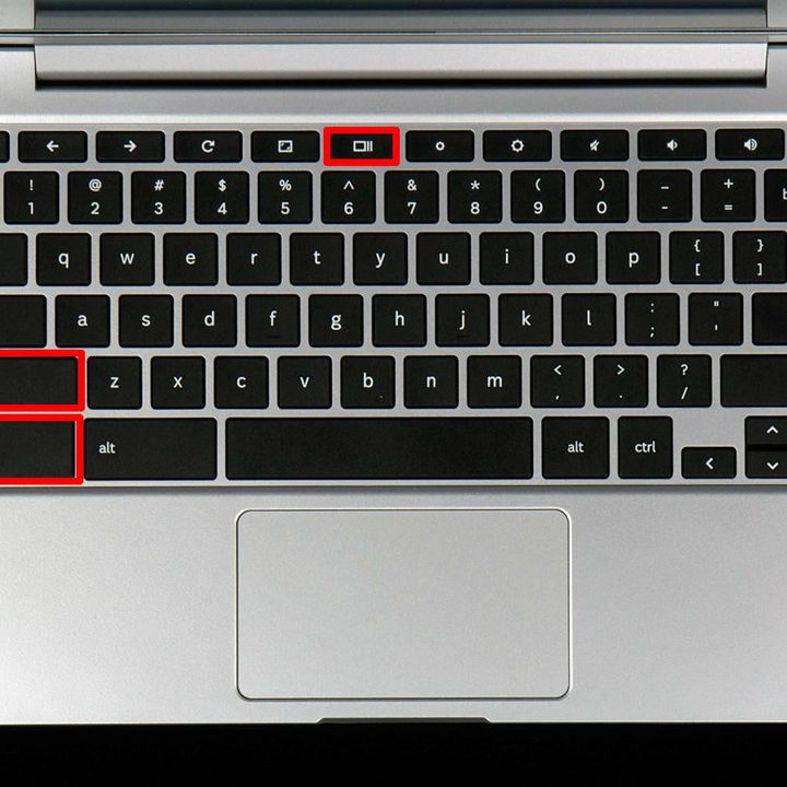 Teclado de una Chromebook vista desde arriba con las teclas marcadas en rojo para una captura parcial de pantalla.