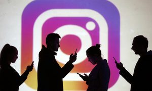 instagram lo mas viral 2019 image  silhouettes of mobile users are seen next to a screen projection logo in this picture illu