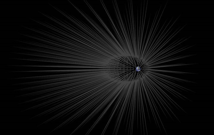 La imagen muestra filamentos de materia oscura emergiendo desde la superficie de la Tierra.