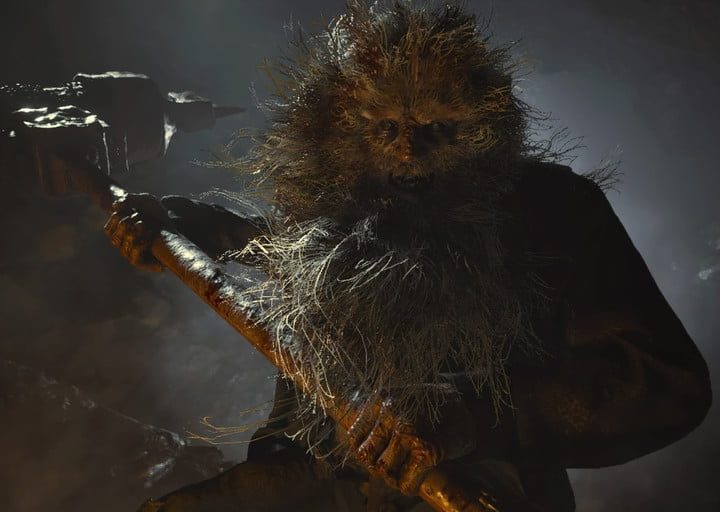 Un zombi atacando en Resident Evil Village.