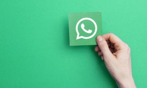 whatsapp chat contigo mismo london  uk may 7th 2017 hand holding logo