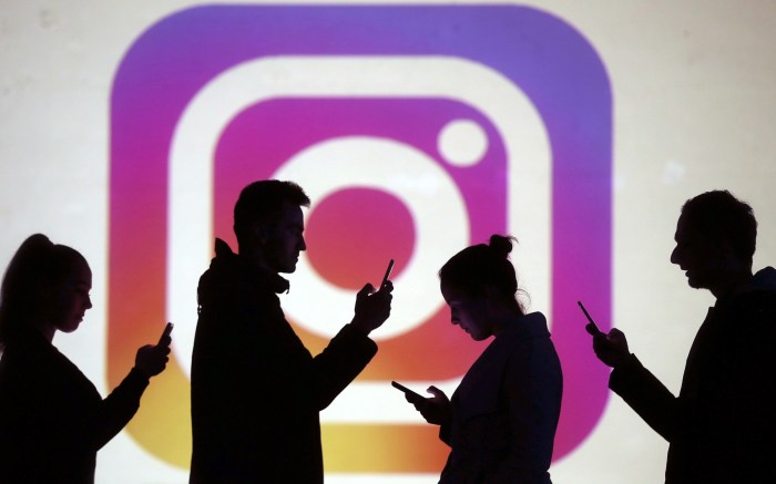 instagram lo mas viral 2019 image  silhouettes of mobile users are seen next to a screen projection logo in this picture illu