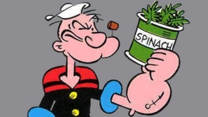 La imagen muestra a Popeye sosteniendo un tarro de espinacas.