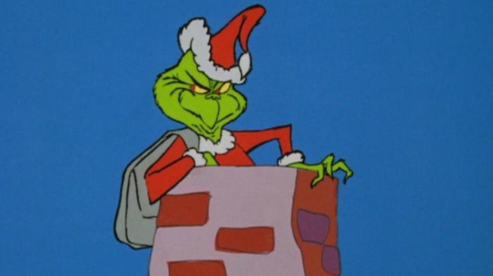 La imagen muestra al personaje de El Grinch en la animación de 1966.