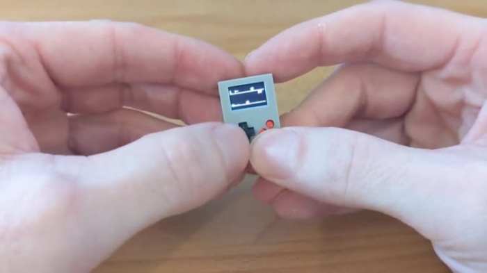 La imagen muestra el pequeño dispositivo Arduoboy Nano.