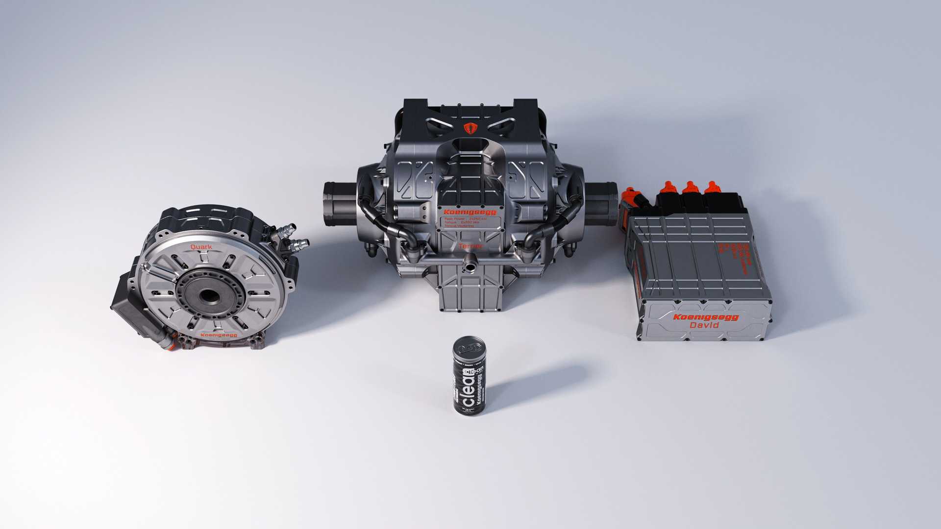 Los motores eléctricos Quark y Terrier, y el inversor David de Koenigsegg junto a una lata de bebida de aproximadamente 11 onzas (330 ml) puede mostrar cuán pequeños son estos poderosos componentes.