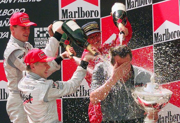 champagne descorchar ondas choques supersonicas auto f1 podium