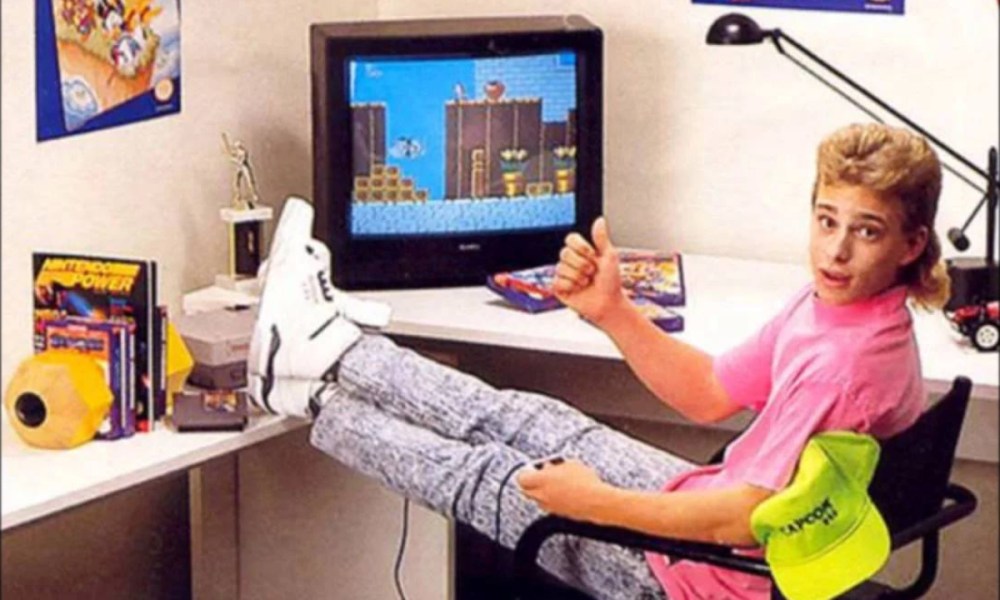 Un niño jugando videojuegos en los 90.